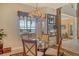 Dining room with a glass table, decorative chandelier, and view of the water at 1007 3Rd E St, Palmetto, FL 34221