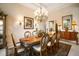 Elegant dining room featuring a chandelier, decorative sconces, and formal seating at 1007 3Rd E St, Palmetto, FL 34221