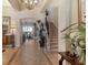 Elegant foyer boasts soaring ceilings, tile flooring, a grand staircase, and an abundance of natural light at 1007 3Rd E St, Palmetto, FL 34221