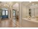 Beautiful foyer showcases tile flooring, a grand chandelier, and views to the dining room and front door at 1007 3Rd E St, Palmetto, FL 34221