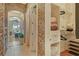 The hallway leading to the living room featuring a closet with organizers and storage at 1007 3Rd E St, Palmetto, FL 34221