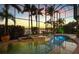 Stunning indoor pool and spa area with lush tropical plants and views of the water at 1007 3Rd E St, Palmetto, FL 34221