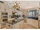 Bright kitchen featuring white cabinets, granite countertops, and stainless steel appliances at 1007 3Rd E St, Palmetto, FL 34221