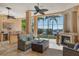 Outdoor lanai features a fireplace, summer kitchen, and views of the pool and waterfront at 1007 3Rd E St, Palmetto, FL 34221