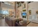 Spacious living room boasts soaring ceilings, a fireplace, and stunning waterfront views from sliding glass doors at 1007 3Rd E St, Palmetto, FL 34221