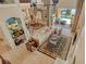 Open floor plan living room with tile flooring, large windows, and seamless access to the outdoor area at 1007 3Rd E St, Palmetto, FL 34221