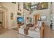 Spacious living room with vaulted ceilings and a staircase leading to the upper level, plenty of natural light at 1007 3Rd E St, Palmetto, FL 34221