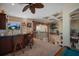 Bright loft featuring a wet bar with scenic views of tropical landscaping and water at 1007 3Rd E St, Palmetto, FL 34221