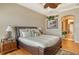 Bedroom with warm tones, a ceiling fan, and an ensuite bathroom at 1007 3Rd E St, Palmetto, FL 34221