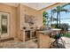 Outdoor kitchen with bar seating and stainless steel grill, perfect for entertaining guests and enjoying outdoor meals at 1007 3Rd E St, Palmetto, FL 34221
