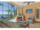 Inviting covered patio featuring a fireplace, waterfront views and comfortable seating area for relaxing and entertaining at 1007 3Rd E St, Palmetto, FL 34221