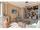 Inviting covered patio with fireplace and living area, perfect for relaxing and enjoying the indoor/outdoor space at 1007 3Rd E St, Palmetto, FL 34221