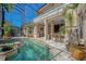 A beautiful backyard pool area, covered with a screen, includes a spa and views of the intercoastal at 1007 3Rd E St, Palmetto, FL 34221