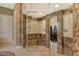 Walk-in shower featuring beautiful tiling and glass enclosure, creating a spa-like retreat at 1007 3Rd E St, Palmetto, FL 34221