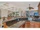 The wet bar is positioned near a stairway and a game room at 1007 3Rd E St, Palmetto, FL 34221