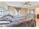 Luxurious main bedroom with ceiling fan, stylish furnishings, and ample space for relaxation and comfort at 1122 42Nd E Ter, Bradenton, FL 34208