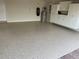 Well-maintained garage with epoxy flooring, built-in cabinets, and plenty of storage solutions at 11629 Garessio Ln, Sarasota, FL 34238
