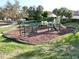 Well-maintained community playground featuring swings, slides, and climbing structures for enjoyment at 13223 Ramblewood Trl, Lakewood Ranch, FL 34211