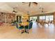 Inviting community room featuring bookshelves, tile floors, ceiling fans, and a kitchenette at 1612 Pine Harrier Cir, Sarasota, FL 34231