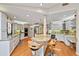 Kitchen with granite countertops, wine cooler and an island with breakfast bar seating at 1612 Pine Harrier Cir, Sarasota, FL 34231