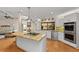 Kitchen featuring granite countertops, stainless steel appliances and view to the Gathering room at 1612 Pine Harrier Cir, Sarasota, FL 34231