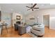 Cozy living room with fireplace, vaulted ceilings, and comfortable seating at 1612 Pine Harrier Cir, Sarasota, FL 34231