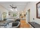 Bright living room with skylights, open to the kitchen, and contemporary furnishings at 1612 Pine Harrier Cir, Sarasota, FL 34231