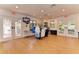Pro shop with display racks of tennis and swimming apparel for sale at 1612 Pine Harrier Cir, Sarasota, FL 34231