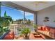 Cozy screened balcony with outdoor seating and views of the lush landscaping at 2001 Bal Harbor Blvd # 2301, Punta Gorda, FL 33950