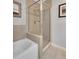 Elegant bathroom features a bathtub and glass-enclosed shower with neutral tile and modern fixtures at 2001 Bal Harbor Blvd # 2301, Punta Gorda, FL 33950