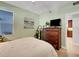 Bright bedroom with a large window, ceiling fan, and comfortable bed at 2001 Bal Harbor Blvd # 2301, Punta Gorda, FL 33950