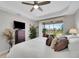 Bedroom with a ceiling fan, dresser, and natural light at 2001 Bal Harbor Blvd # 2301, Punta Gorda, FL 33950