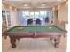 Recreation room features a pool table with tables, chairs, and patio doors in the background at 2001 Bal Harbor Blvd # 2301, Punta Gorda, FL 33950