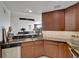 Well-equipped kitchen with stainless steel appliances and wooden cabinets at 2001 Bal Harbor Blvd # 2301, Punta Gorda, FL 33950