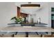 Kitchen featuring stone countertops, pendant lighting, and modern appliances at 2001 Bal Harbor Blvd # 2301, Punta Gorda, FL 33950