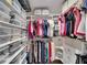 Organized walk-in closet with custom shelving and ample storage space for clothes and accessories at 2001 Bal Harbor Blvd # 2301, Punta Gorda, FL 33950