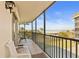 Spacious balcony with tile flooring and stunning views of the surrounding landscape at 25188 Marion Ave # E208, Punta Gorda, FL 33950