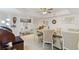 Bright dining room with a tray ceiling and an organ at 25188 Marion Ave # E208, Punta Gorda, FL 33950