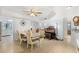Bright dining room with wood-look floors and an electric organ at 25188 Marion Ave # E208, Punta Gorda, FL 33950