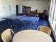 Community game room equipped with ping pong table, pool table, and lounge area at 25188 Marion Ave # E208, Punta Gorda, FL 33950
