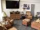 Resident lounge with comfortable seating and a large TV at 25188 Marion Ave # E208, Punta Gorda, FL 33950