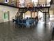 Meeting room with high ceilings, a large table, and natural light at 25188 Marion Ave # E208, Punta Gorda, FL 33950