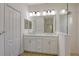 Bathroom with double vanity, and glass-enclosed shower at 309 Potenza Loop, Nokomis, FL 34275