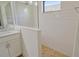 Bright bathroom featuring a glass-enclosed shower with subway tile and neutral color palette at 309 Potenza Loop, Nokomis, FL 34275