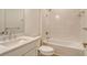 Well-lit bathroom featuring a tiled shower, bathtub and sink with ample counter space at 309 Potenza Loop, Nokomis, FL 34275