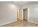 Neutral bedroom with wood-look tile floors and closet showcasing ample storage at 309 Potenza Loop, Nokomis, FL 34275
