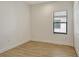 Neutral bedroom showcasing tile floors, a window with blinds, and a closet at 309 Potenza Loop, Nokomis, FL 34275