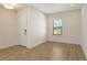 Entryway with wood-look tile floors, recessed lighting and view to front yard at 309 Potenza Loop, Nokomis, FL 34275