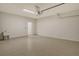 Spacious garage with epoxy flooring, utility sink, and ample room for parking at 309 Potenza Loop, Nokomis, FL 34275