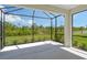 Relaxing screened lanai overlooking a private backyard and green space at 309 Potenza Loop, Nokomis, FL 34275